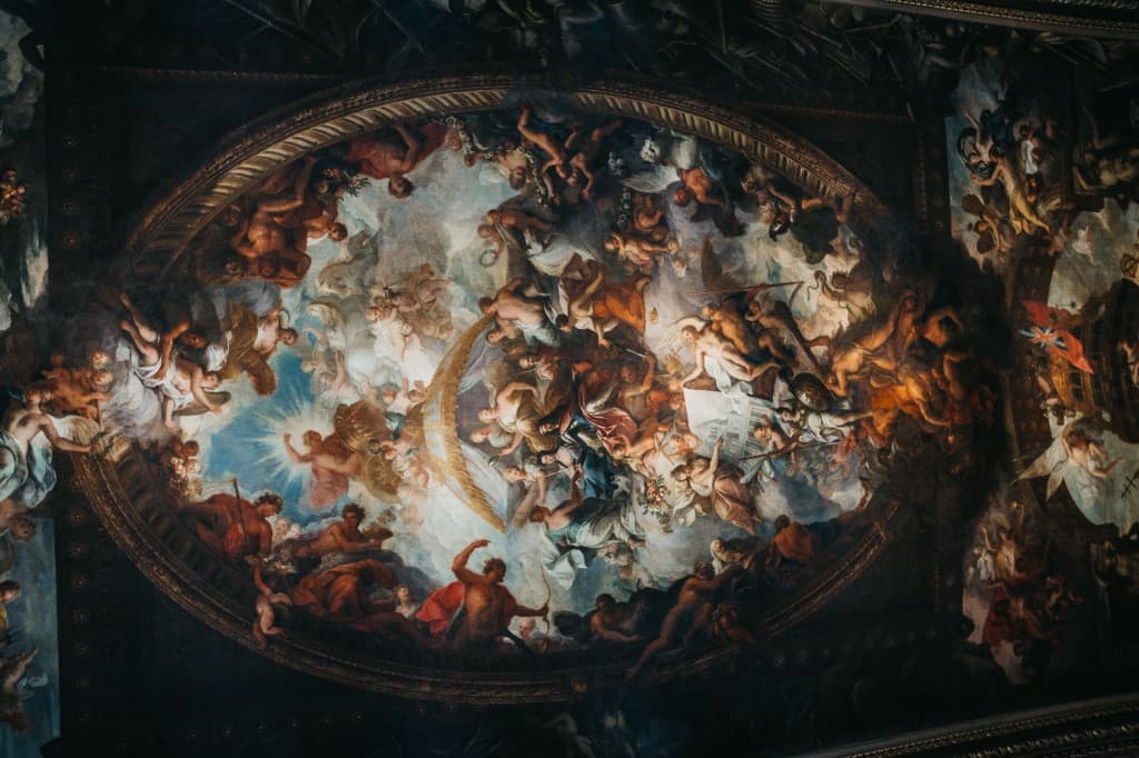 A grand classical ceiling fresco depicting allegorical and angelic figures in a celestial scene with radiant divine light